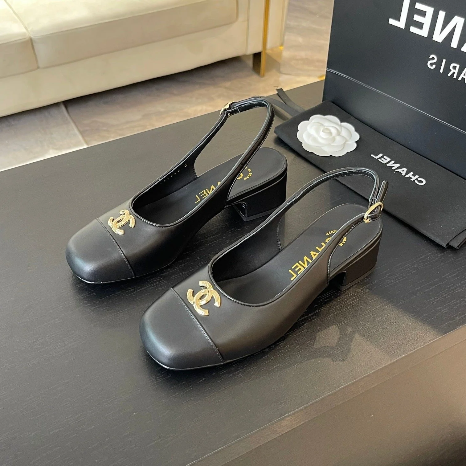 CC SLINGBACKS IN BLACK CALFSKIN
