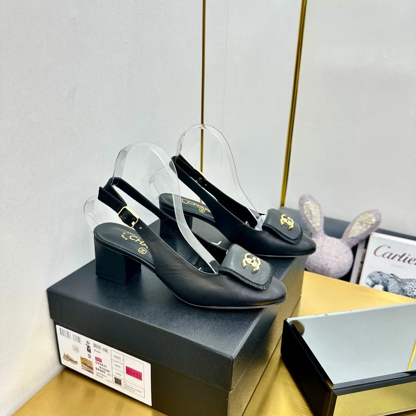 CC SLINGBACK 25S IN BLACK CALFSKIN WITH GOLD HARDWARE
