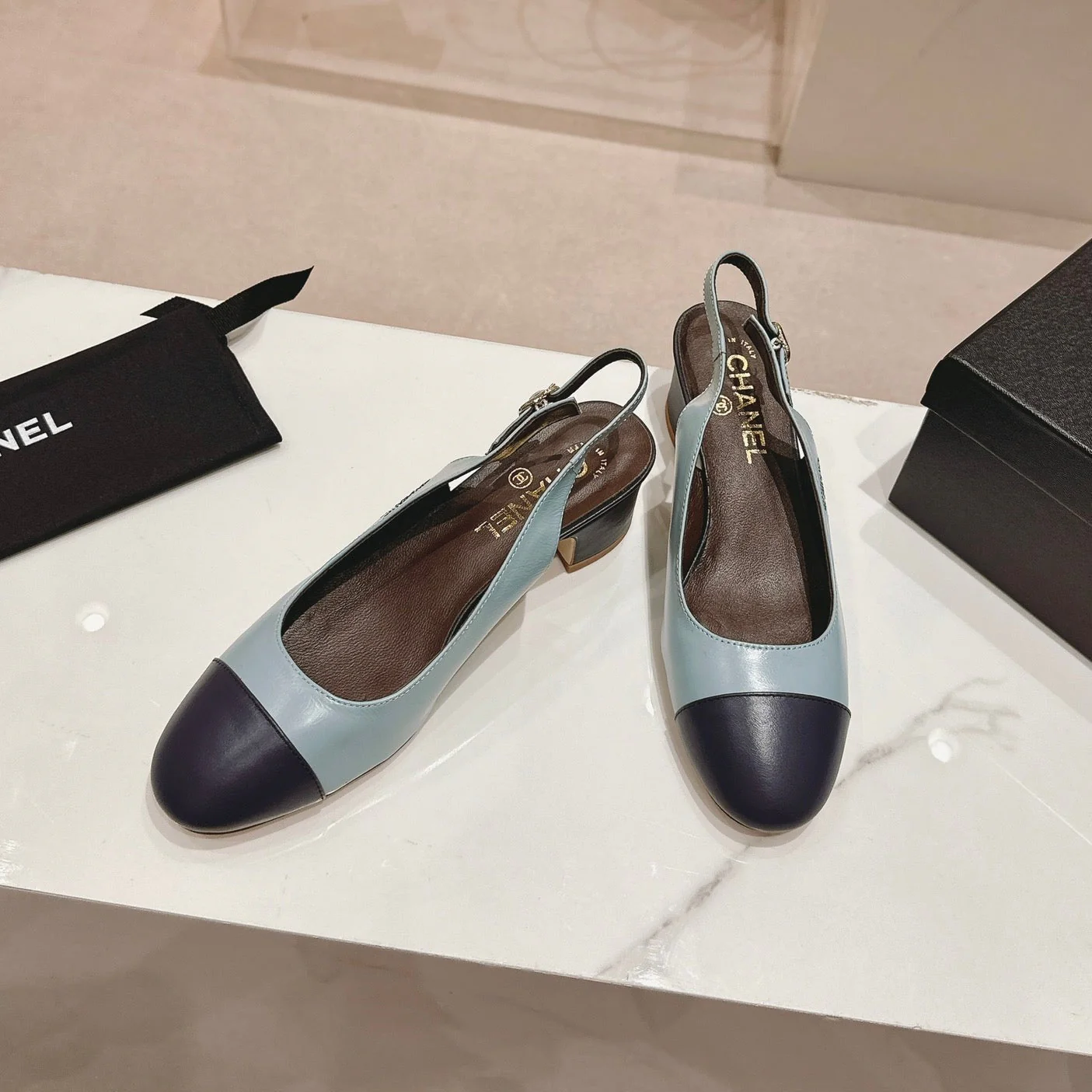 SLINGBACKS LIGHT BLUE MIX BLACK SHEEPSKIN