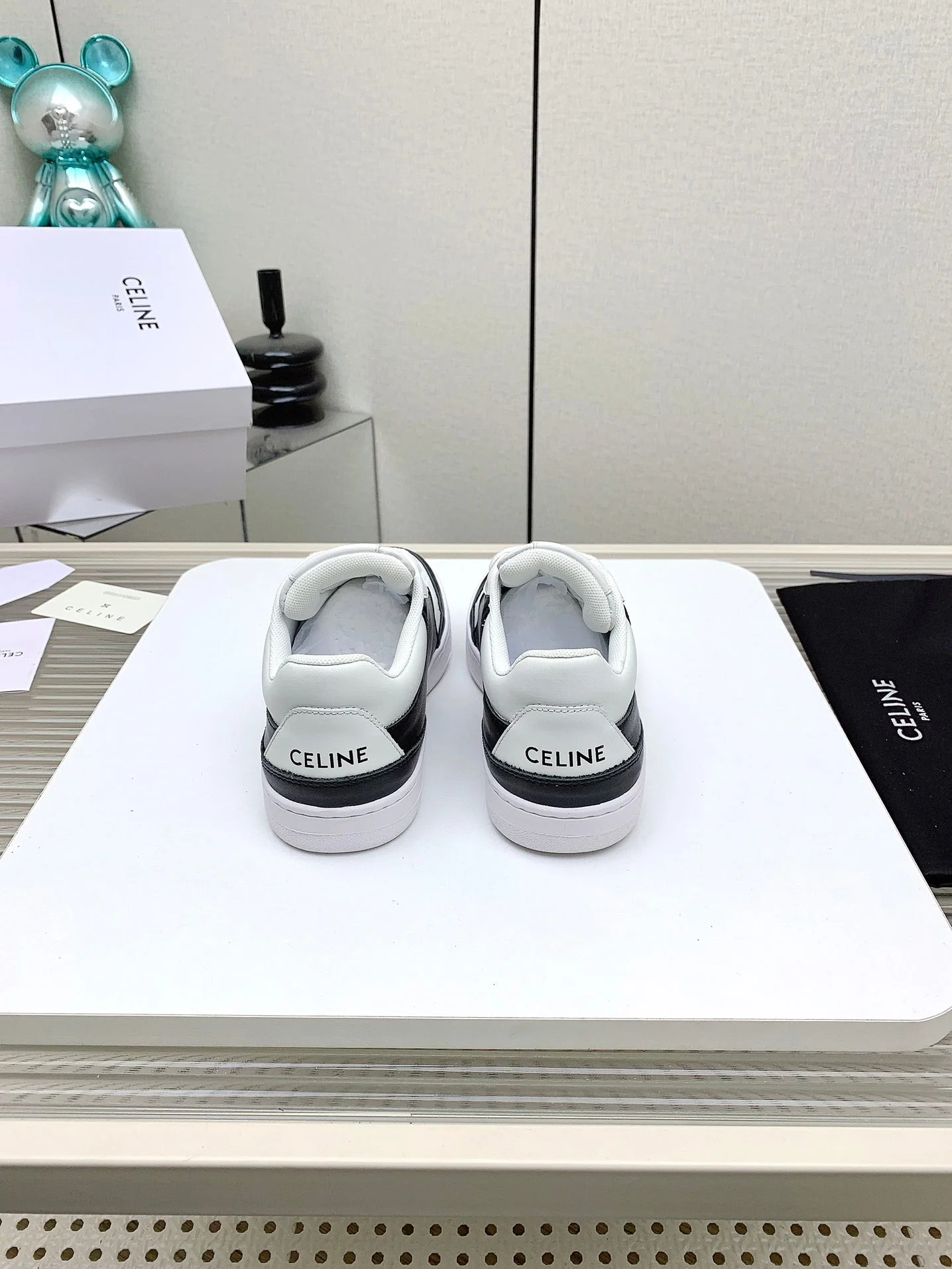 SNEAKER WITH TRIOMPHE IN BLACK AND WHITE CALFSKIN