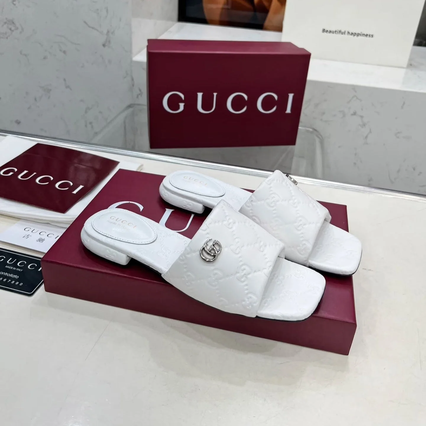 GG CASUAL SLIPPERS IN WHITE CALFSKIN LOGO EMBOSSING