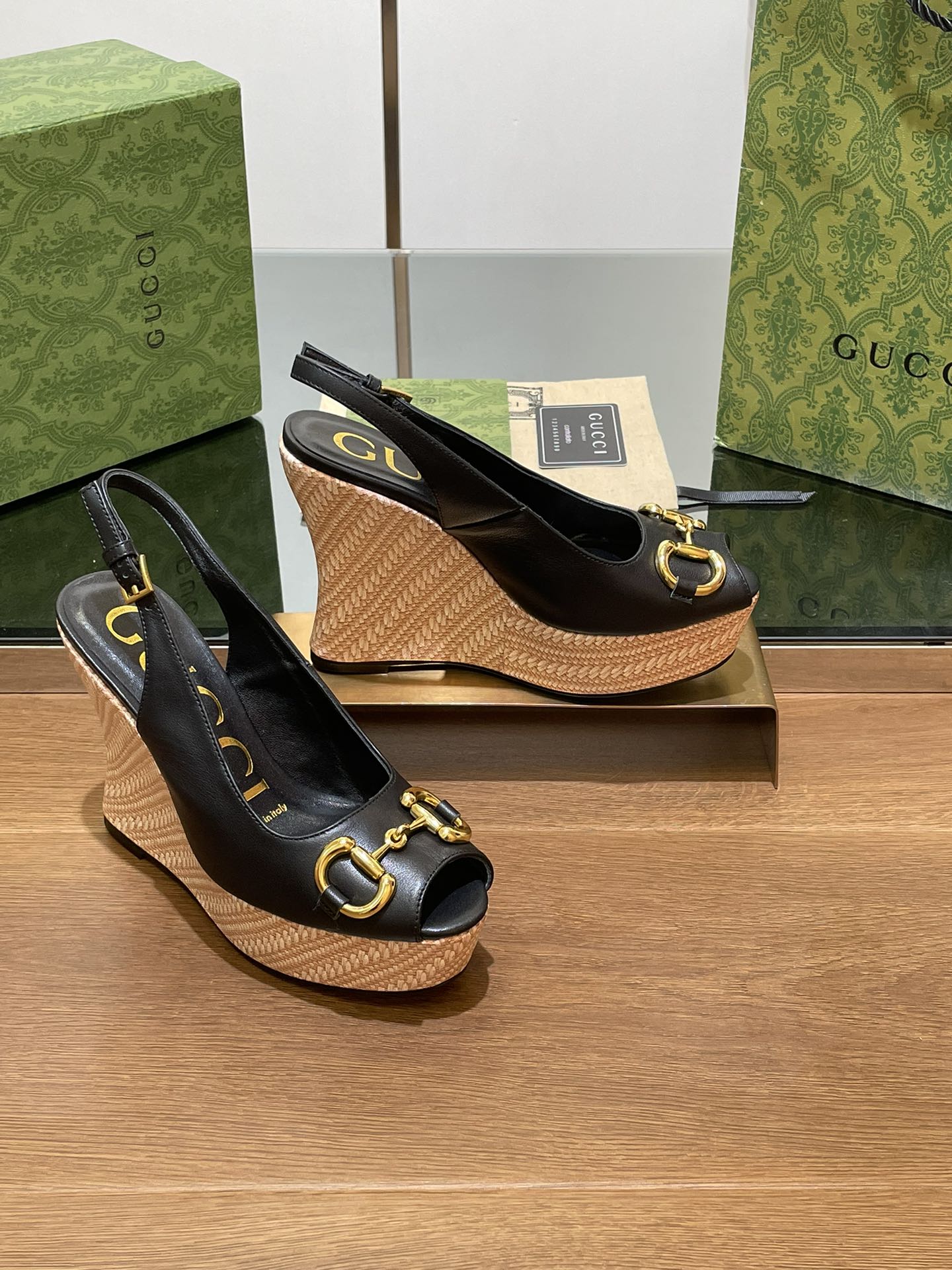 GG WEDGE PLATFORM IN BLACK CALFSKIN WITH GOLD HARDWARE