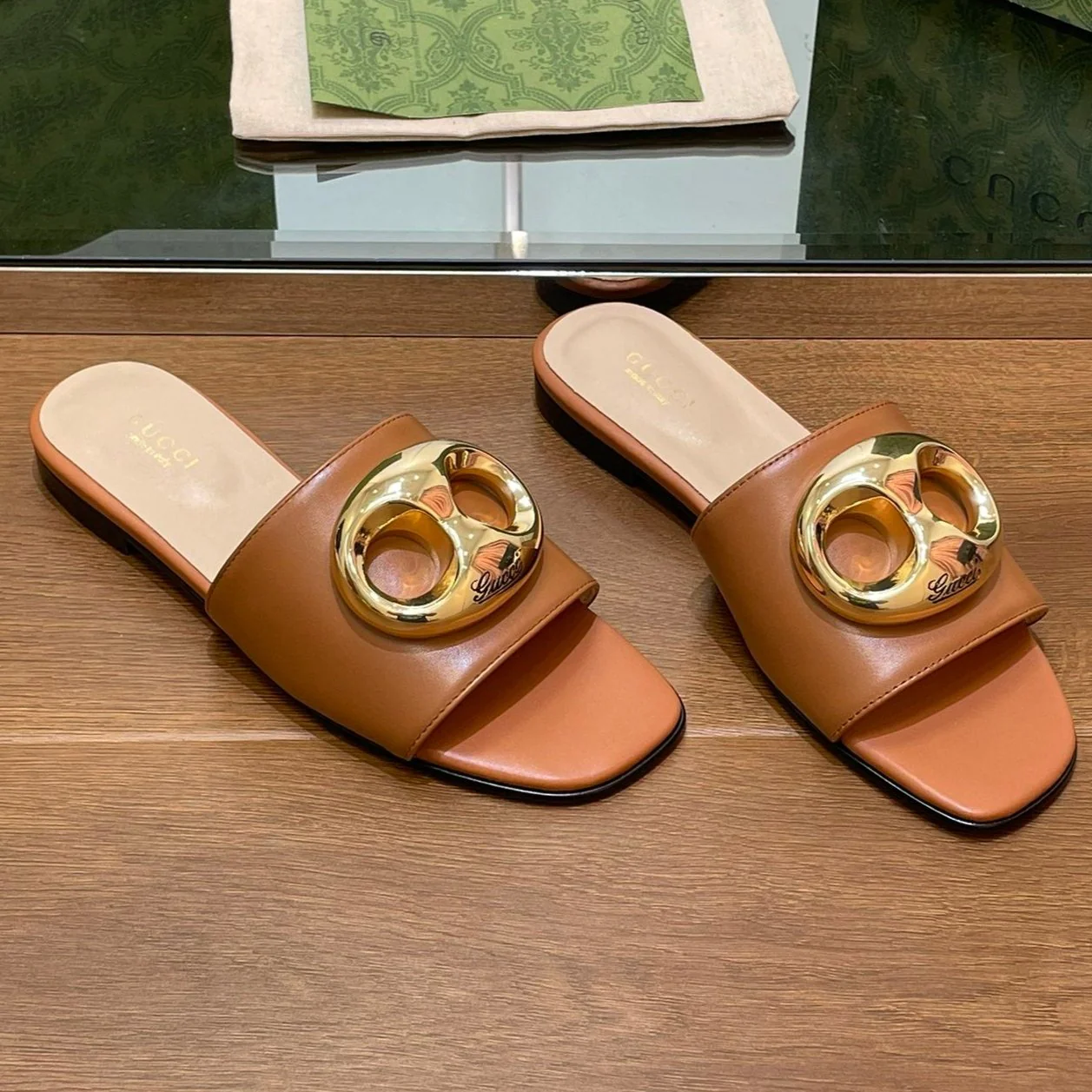 FLAT MULE IN BRONE BROWN CALFSKIN WITH GOLD HARDWARE