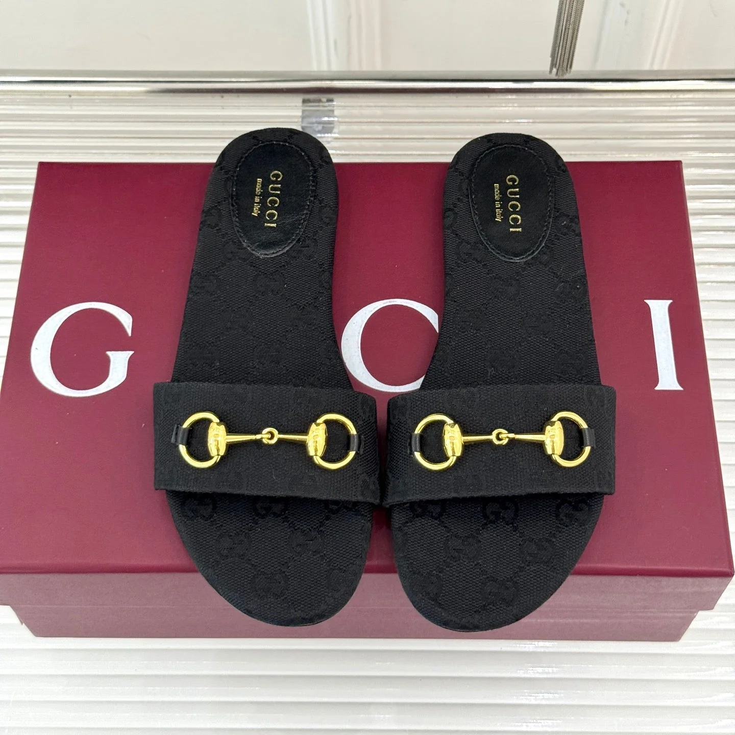 SLIDE SANDALS IN BLACK FABRIC EMBOSSED LOGO
