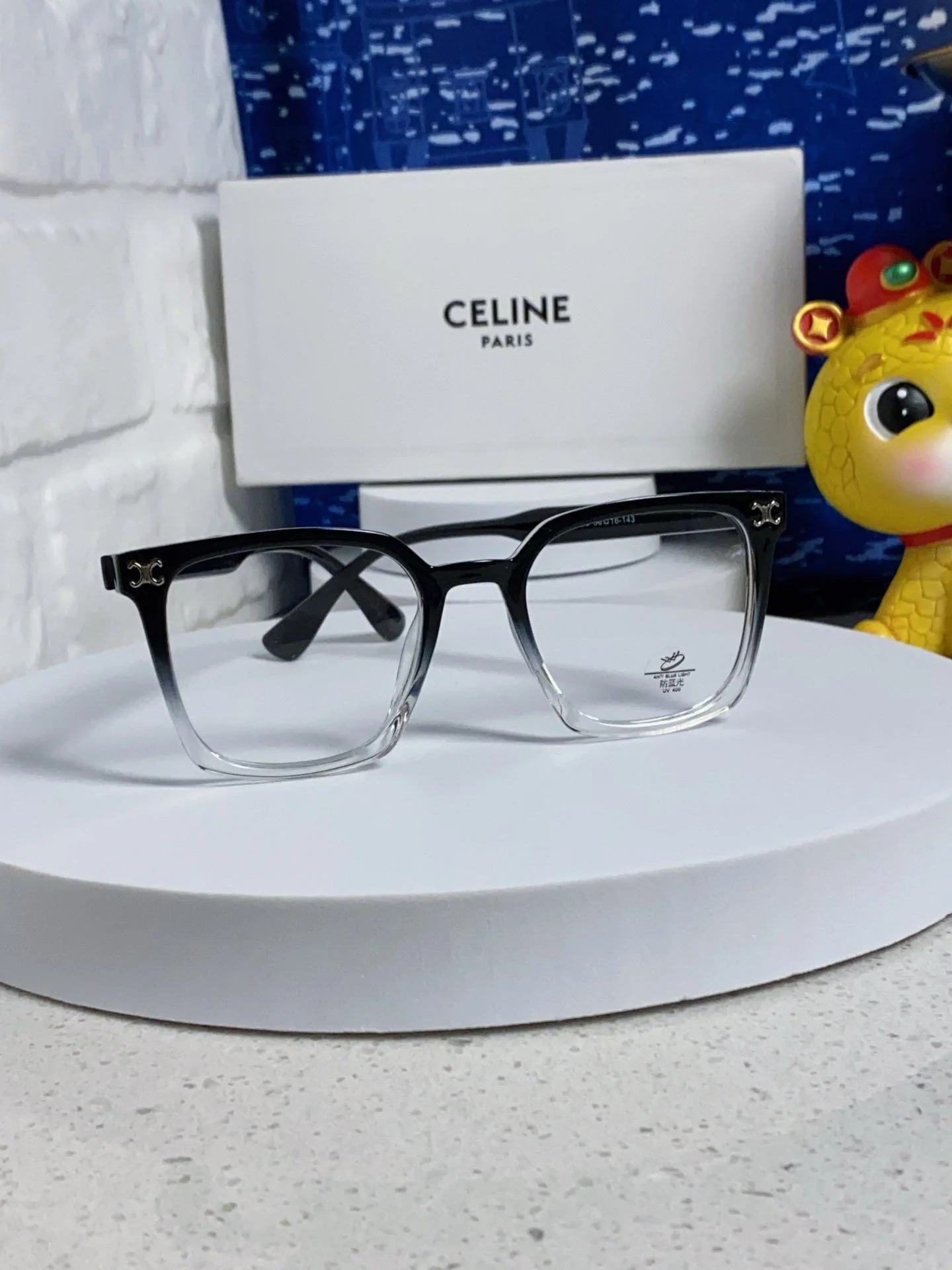 TRIOMPHE SUNGLASSES 563255 IN BLACK TO CLEAR ACETATE